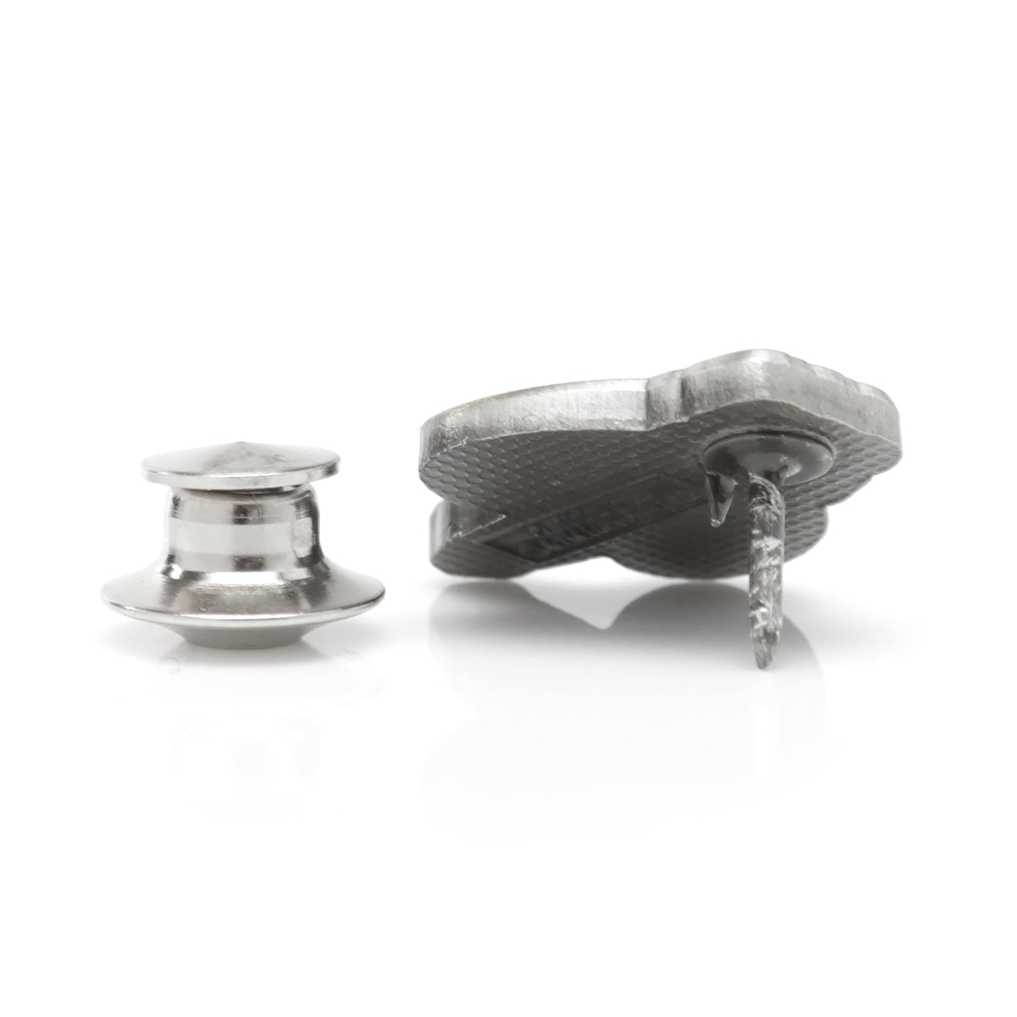 A silver lapel pin on a white background