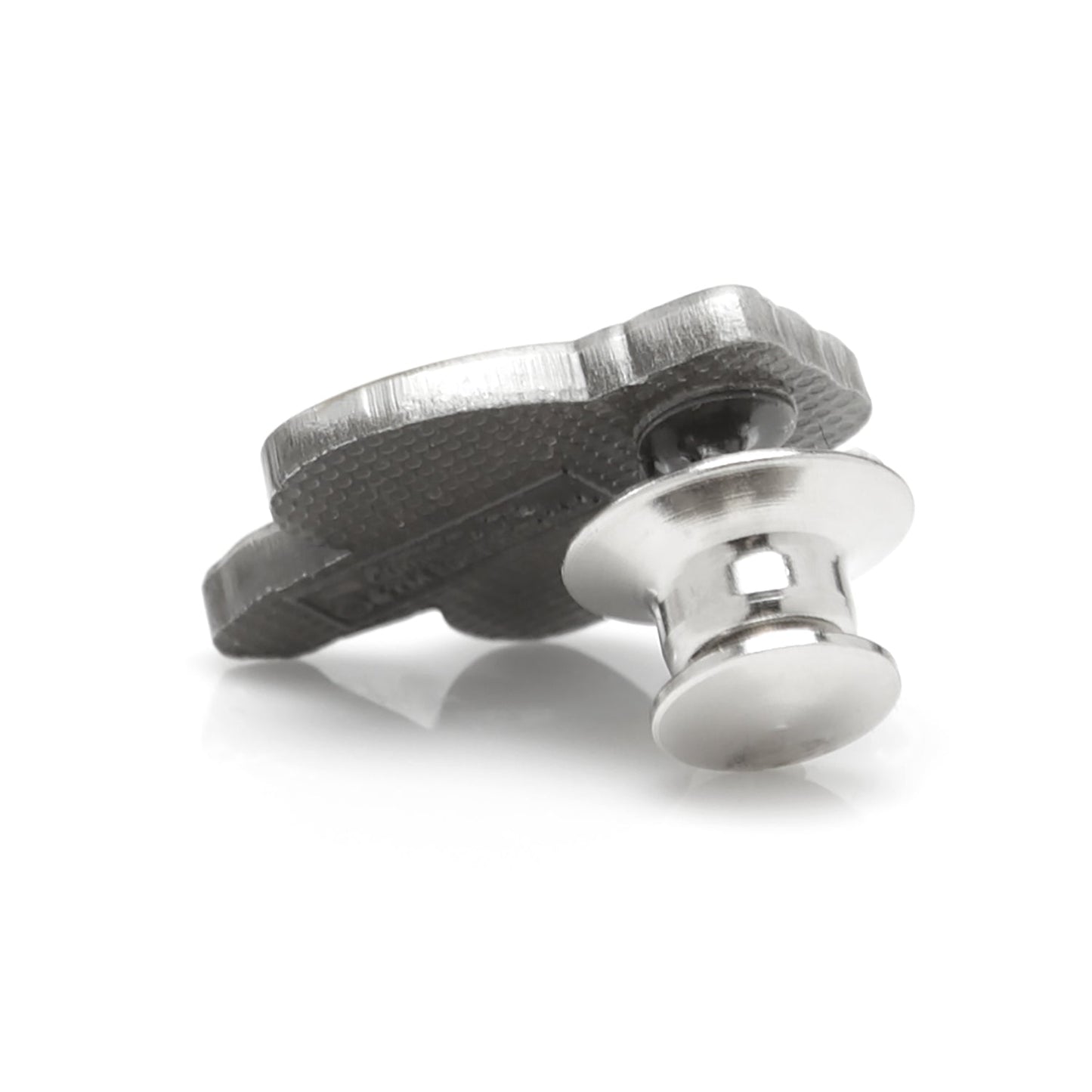 A silver lapel pin on a white background