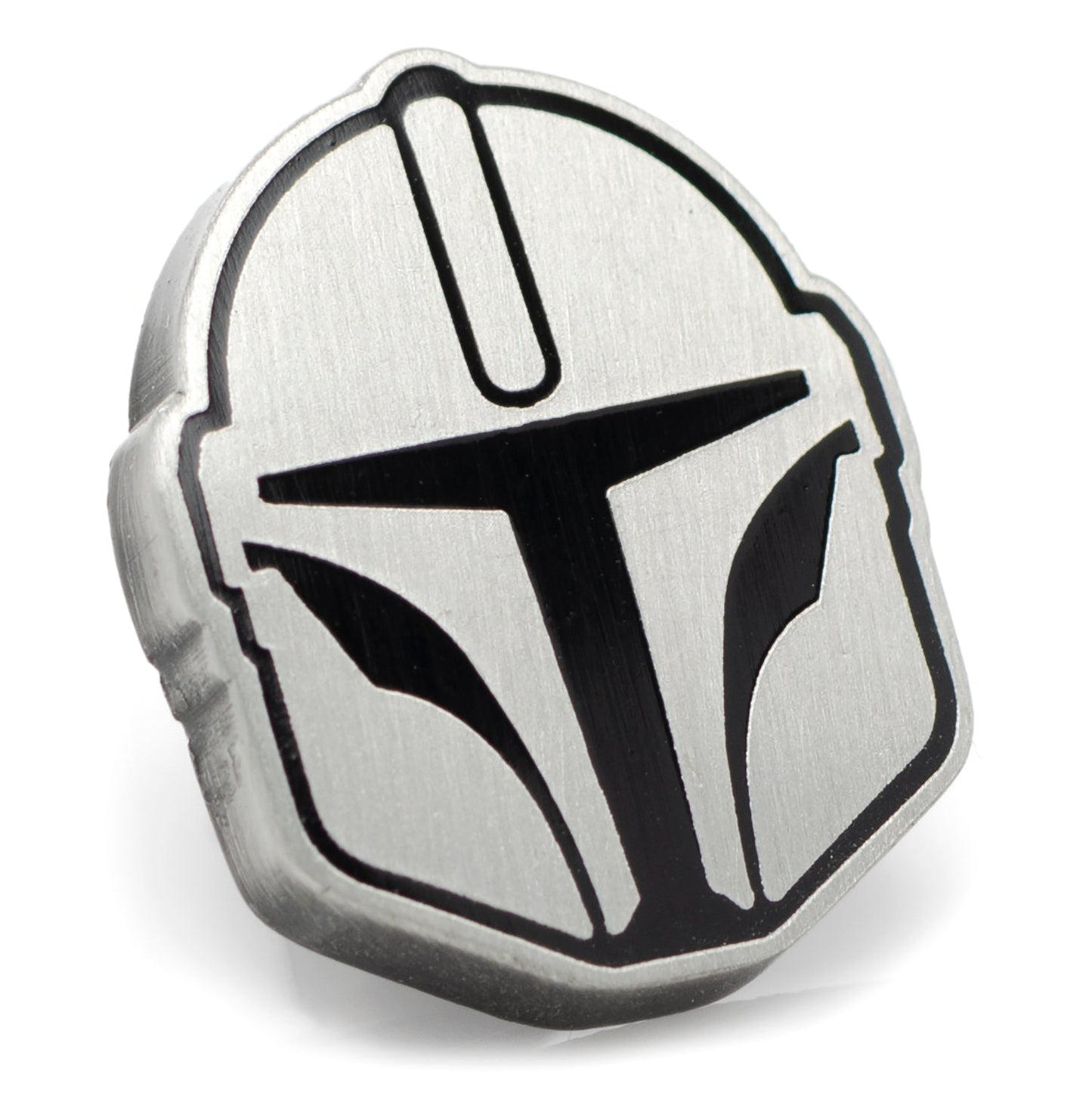 A black and silver lapel pin depicting a Mandalorian helmet