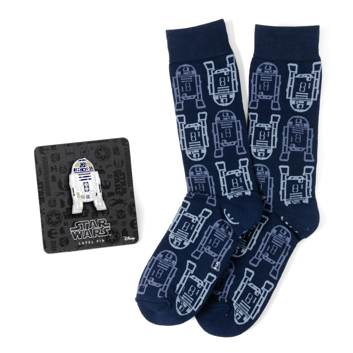 Navy blue socks with R2-D2 pattern and matching pin on a white background