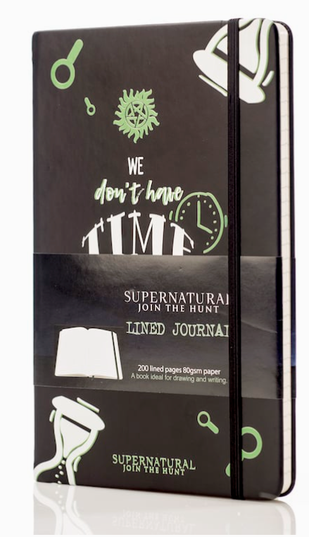 An image of a black journal on a white background. The cover has drawings of white hourglasses in the corners, and a green anti-possession symbol in the center. White text says "we don't have time for any of your blah, blah, blah. Sam winchester."