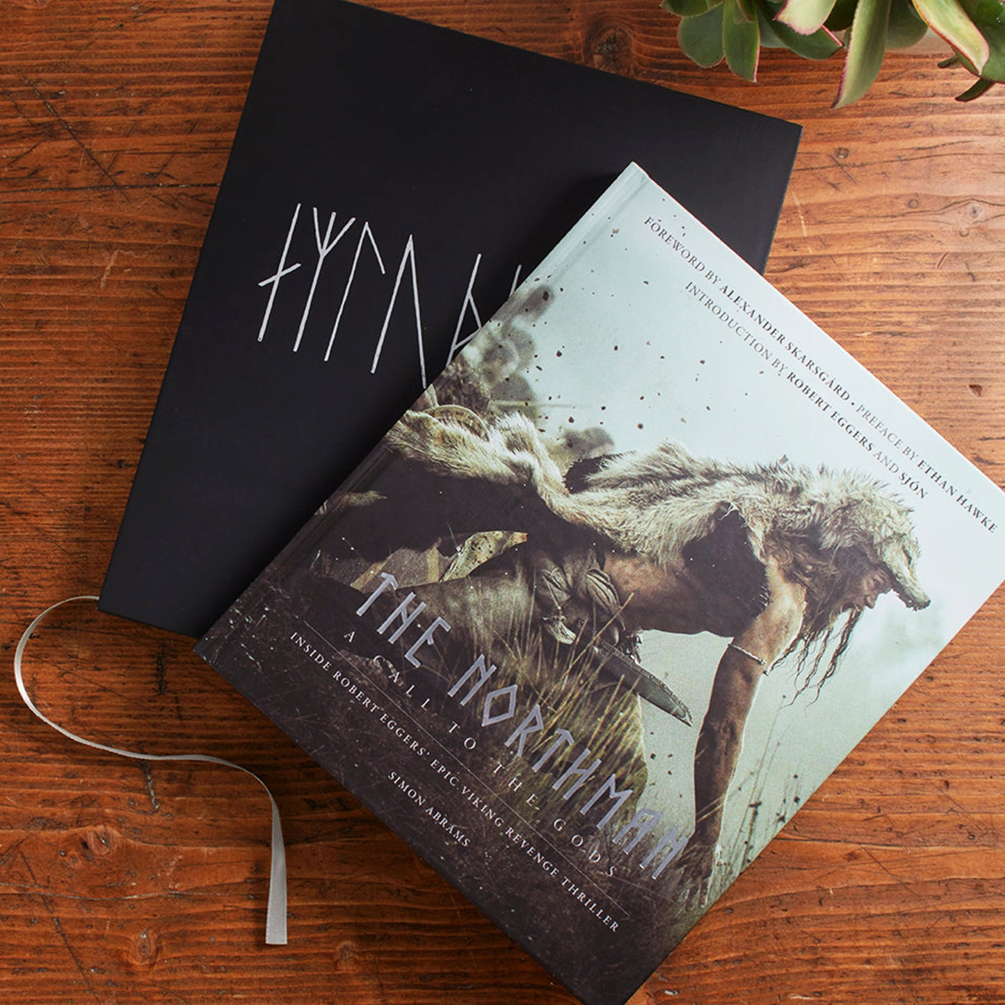 Book titled 'The Hornsmith' on a wooden surface with a black cover