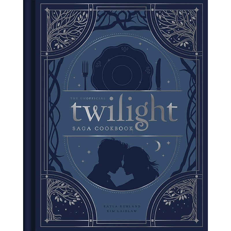 A dark blue book on a white background. The cover depicts the silhouettes of the main characters from the Twilight movies. At the corners are ornate drawings of bare trees. In the center is silver text that says "The unofficial twilight saga cookbook."