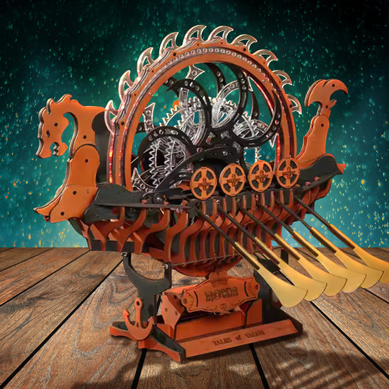 A model of a Viking long ship, with a dragon head at the front and a row of tooth-shaped scales across the back. Long oars are sticking out the sides. The model is perched on a wooden stand, on top of a table. In the background is a sky filled with sparks.