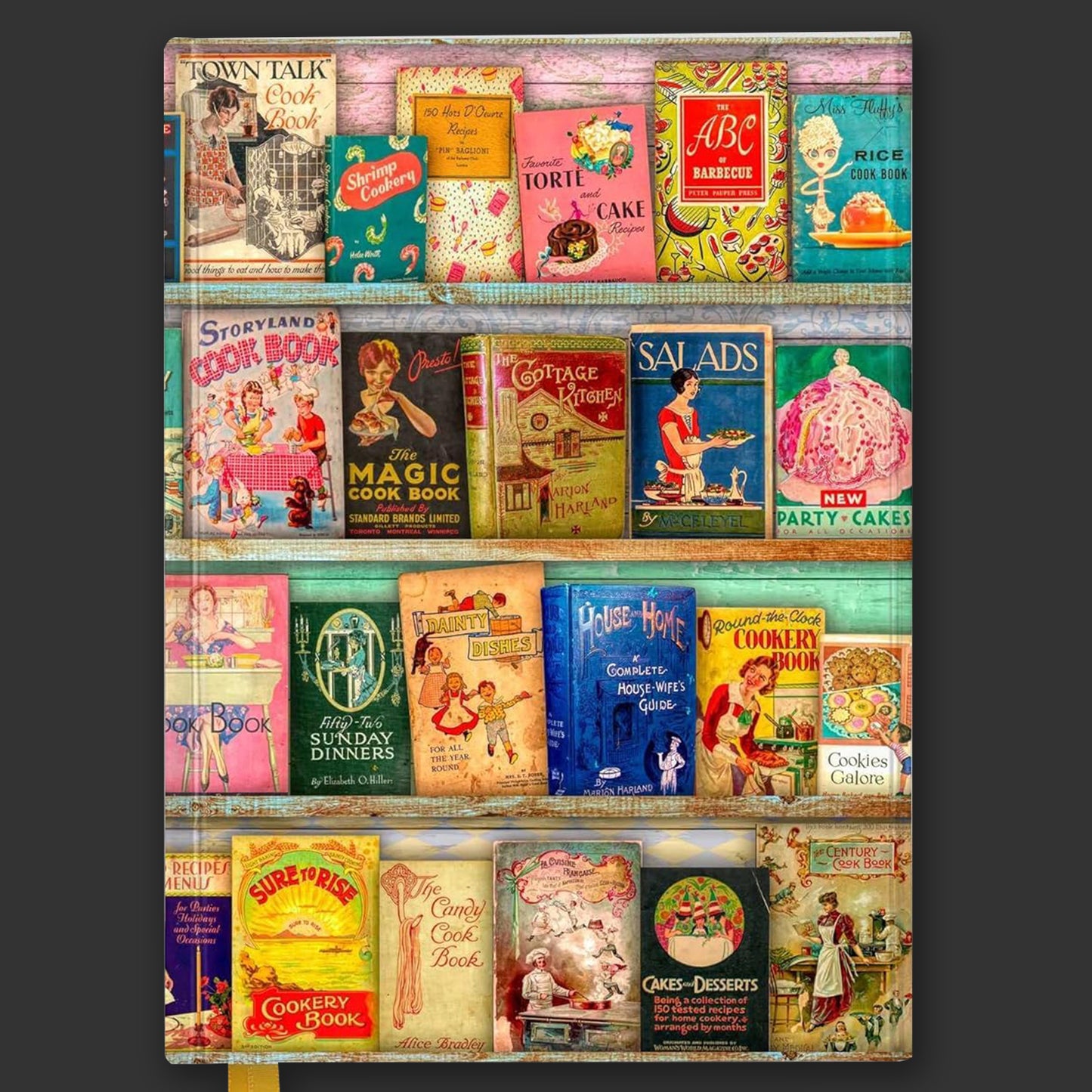 A hardcover journal on a grey background. The front is covered with images of vintage cookbooks lined up on shelves.