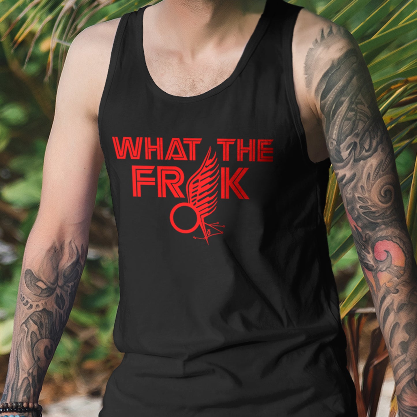 Person wearing a black tank top with red text and design against a natural background