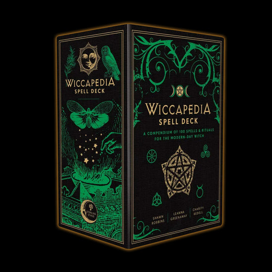 A black and green box on a black background. The box cover has various pagan and wiccan symbols in green. Yellow and green text says "Wiccapedia Spell Deck: a compendium of 100 spells & rituals for the modern-day witch." A ywllow pentagram sits below the title.