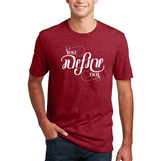 A male model wearing a red T-shirt with white text that says "you define you." The font is designed to look the same rightside up and upside down.