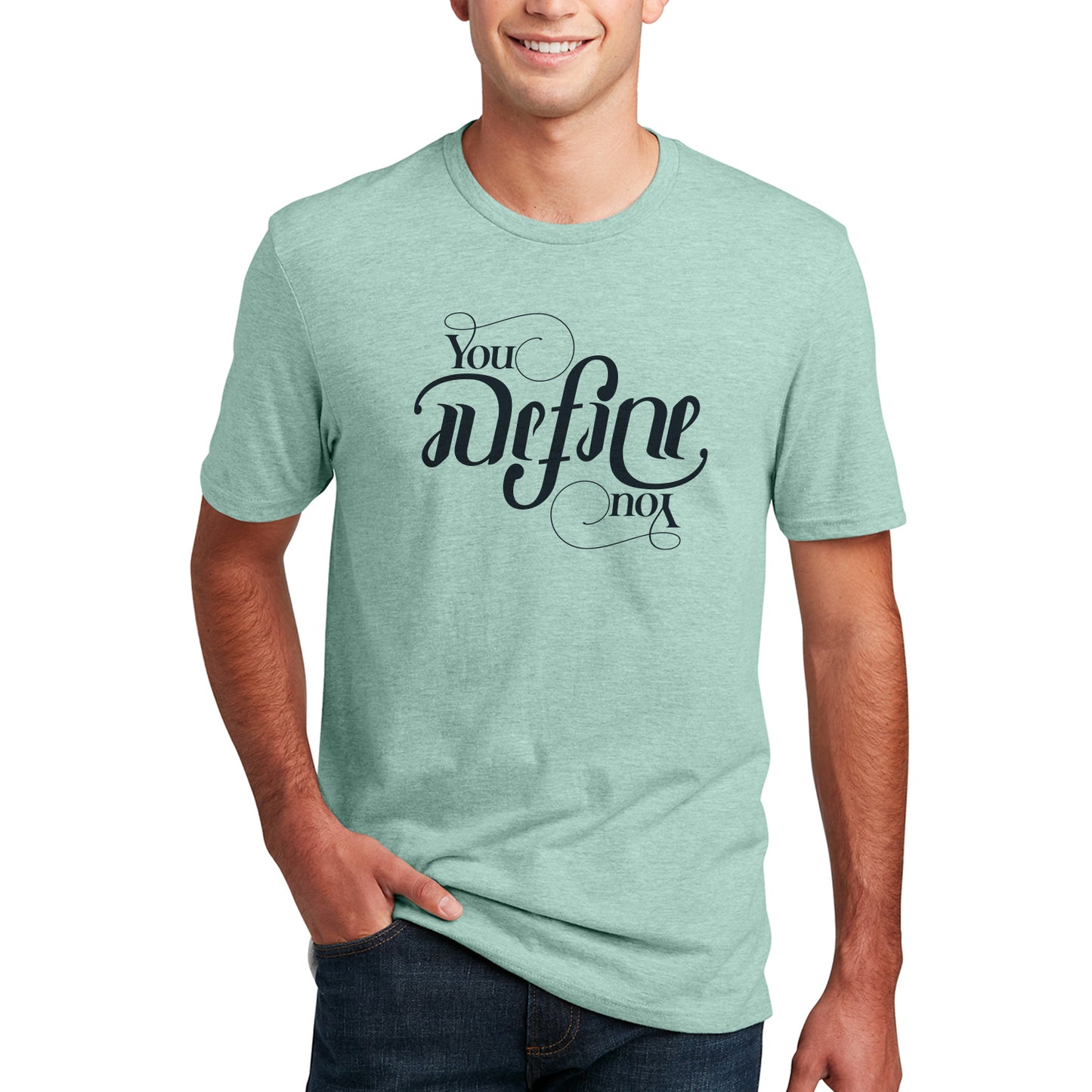 A male model wearing a sage green T-shirt with white text that says "you define you." The font is designed to look the same rightside up and upside down.