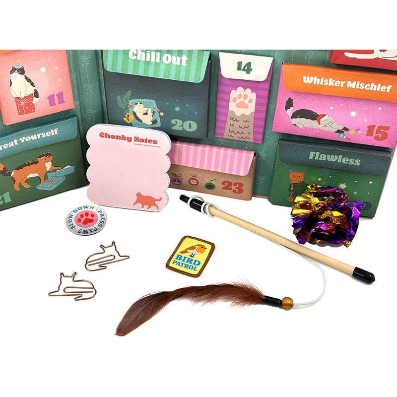 Collection of cat-themed stationery items including cards, notes, and a feather toy on a white background.