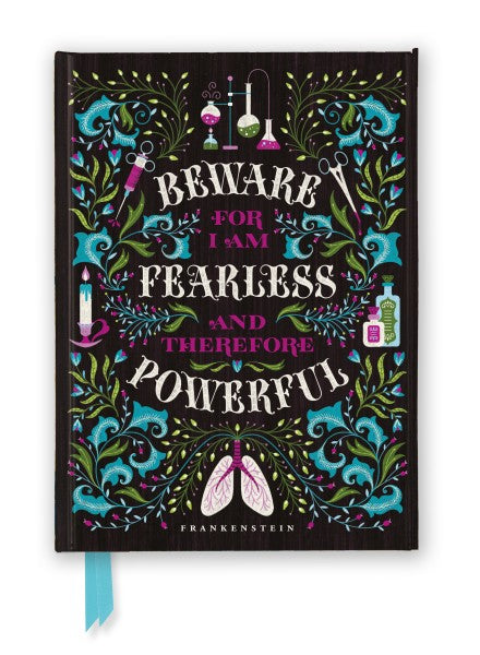 A black book on a white background. On the cover of the book are drawings of lab equipment and flowers. Text in the center of the cover says "beware for I am fearless and therefore powerful." At the bottom of the book is the name "frankenstein."