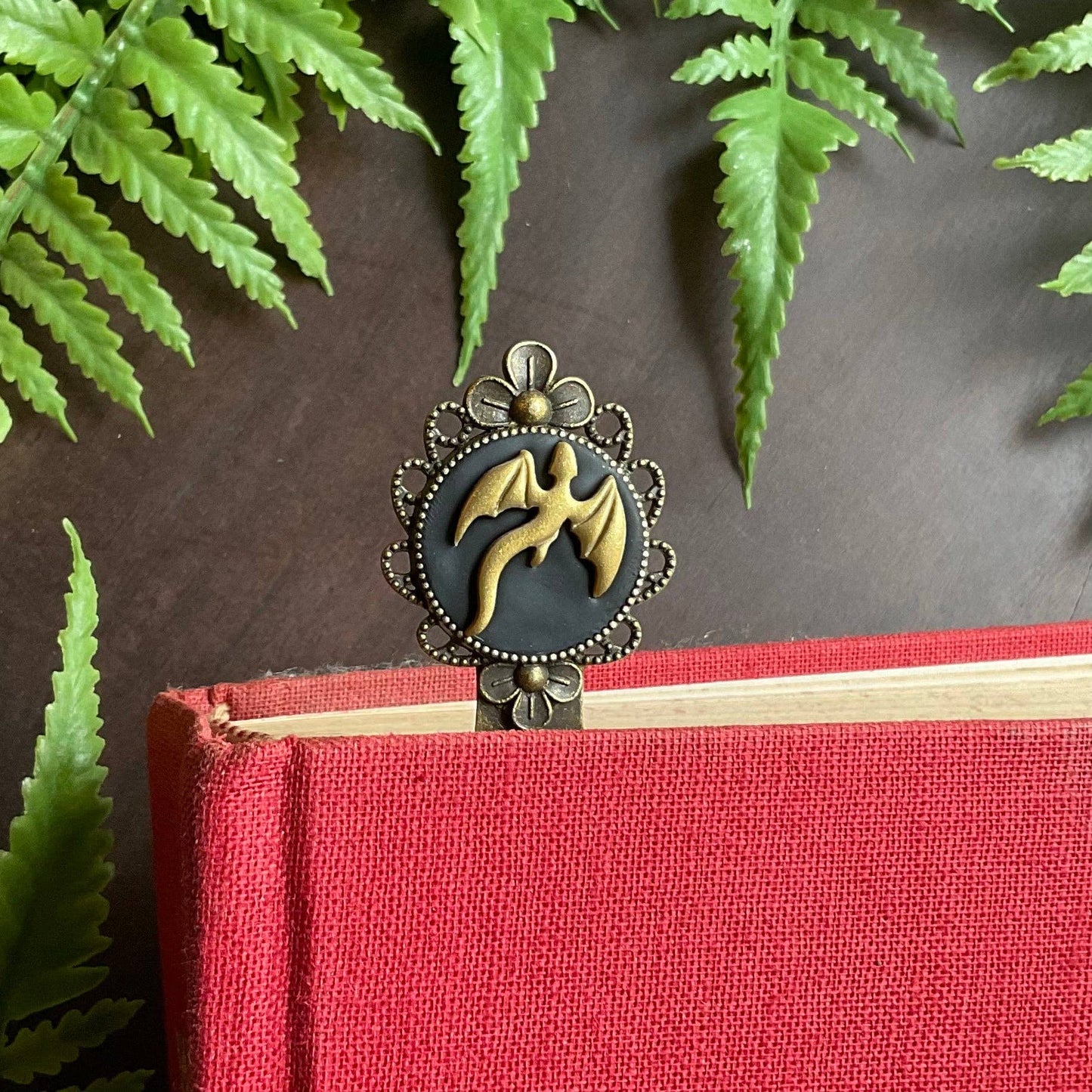 Dragon themed bookmark in a red hardcover book