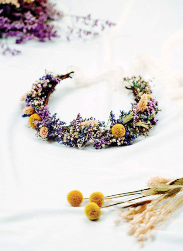 A crown headband of dried flowers and herbs.