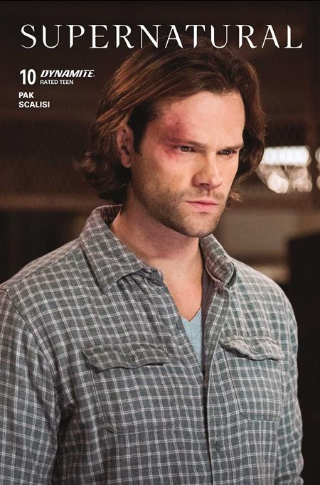 Character from 'Supernatural' wearing a checkered shirt with a blurred background