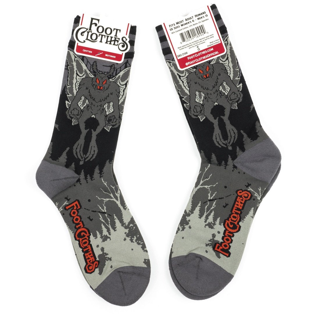 Pair of socks with a wolf design and 'Foot Clothes' branding on a white background